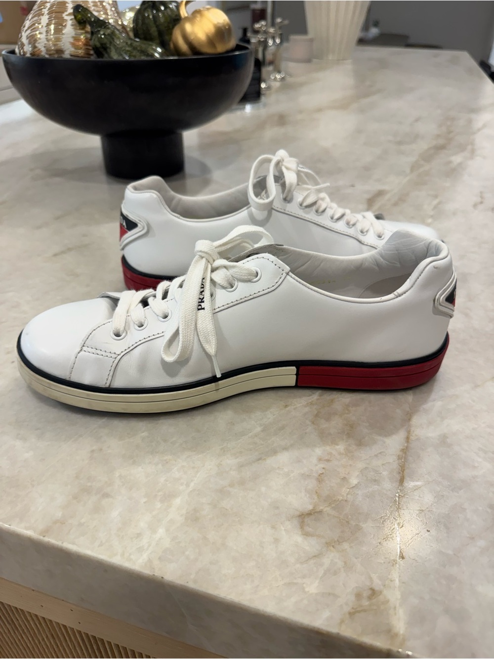 Prada White Leather Low-Top Sneakers with Red and Black Midsole